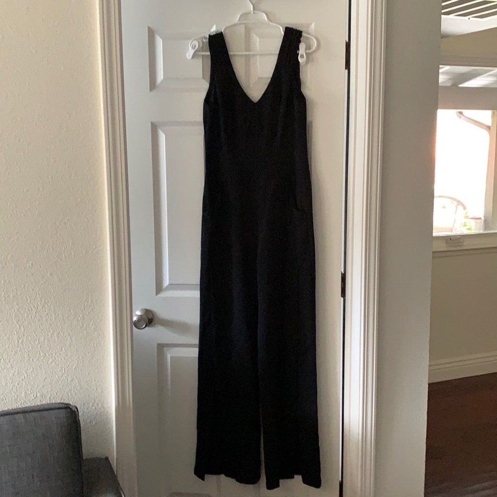 Beautiful black jumpsuit with pockets, slits make it classy 💐